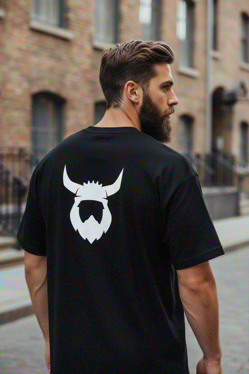 Bearded man showing back of Black Viking t-shirt with helmet logo