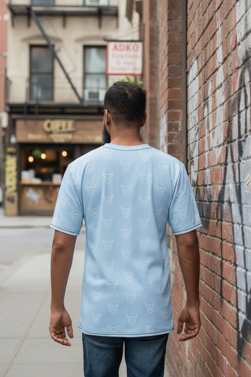 Man walking away down alley showing back of all-over Viking t-shirt