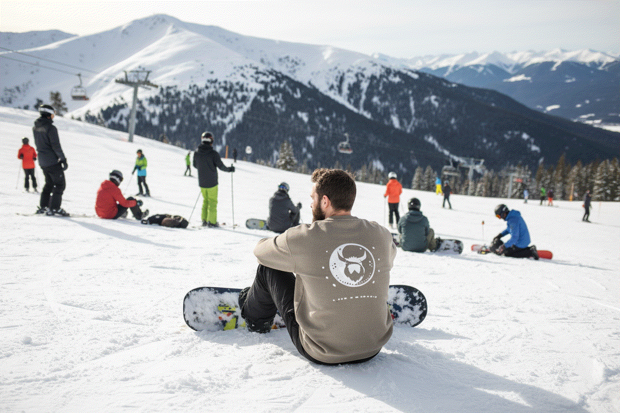 Snowboarder at top of ski run wearing Ying Yang Viking Sweater