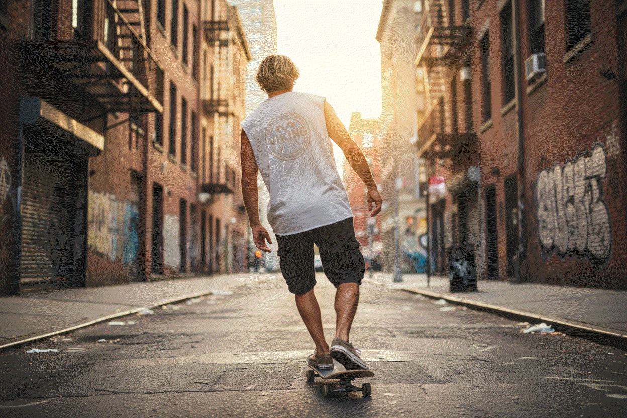 Surfer guy riding skateboard showing back of Raw Edge Viking Tank Top